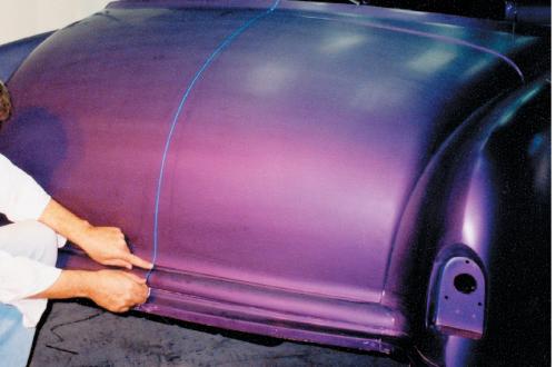 First establish a centerline on the rear decklid, just as you did with the hood and front fenders. 