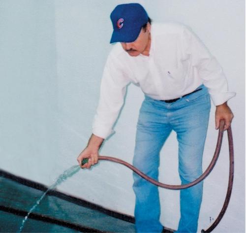  Casper keeps the spray booth floor damp when applying topcoats to help keep dust down. Of course, too much water on the floor can cause other problems, so use common sense. You needn’t be practicing the backstroke in your paint booth.