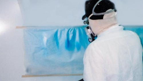 Tape a few sheets of masking paper to the wall of the spray booth. Each time the gun is loaded, use the paper for checking the fan, paint and gun. Make your mistakes on the test paper, not on your prize painting. Casper uses 30 psi at the gun when spraying blends and scallops.