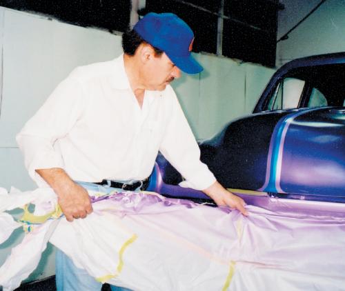 Before the final clearcoats, carefully go over the entire car looking at all of the paint edges. If you find a mistake somewhere, it can still be corrected. Also be on the lookout for any small areas of overspray caused by a “leak” in your masking tape work. Nothing looks worse than a small triangle of pearl overspray on the side of your car!