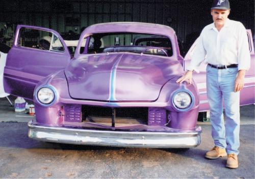 Here we see the finished product: After color sanding and buffing the clear, the scallops are now buried in the topcoat. The long, low lines produce a true custom silhouette, and the scallops make the Merc look even lower. Custom painting at this level can be achieved with patience, and with the assistance of people such as Casper, we’re sure more people will be mixing candies and pearls and creating their own custom jobs. 