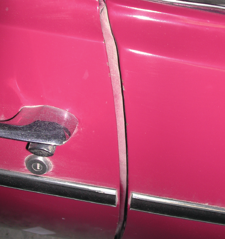 Funny remarks: This photo is not of the car in question; however the huge door gap is similar. This car has obviously been in an accident, and repaired poorly. A similar ’57 Chevy once entered a car show, and when it did not win, the owner used this as an excuse: “You can’t deduct points; I bought it this way.”