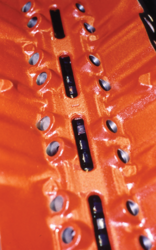 On race engines where oil re-circulation to the oil pan is critical, racers for decades have cleaned their lifter valley then applied Glyptol paint. It hastens oil flow.