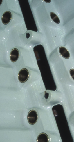 Some shops use white Glyptol paint. Why white? If any minute cracks occur, they are easier to find, and you can more easily see any shiny metal particles, before they become big shiny metal pieces. 