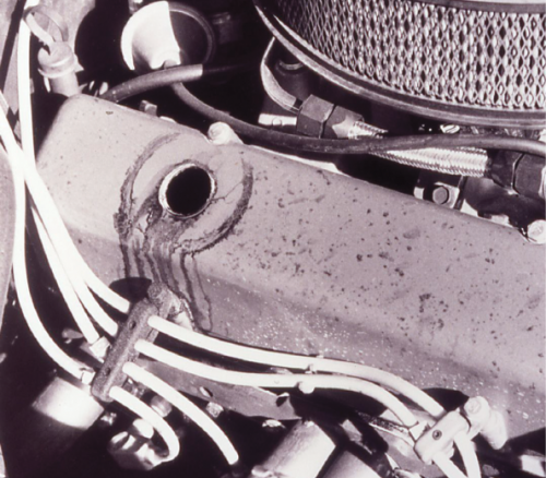 We once bought a ’69 Camaro, and the engine was a very tired 8.5:1 350. We babied it for a year, and then the nodular crankshaft broke in two at the rear journal. Seen here are engine oil droplets on the valve cover—after a high-speed run. High crankcase pressure blew the oil past the breather. When buying a car, pull the PCV valve and plug it with your finger. If you see smoke coming out the grommet hole, it’s oil blow-by. A lot of it is a no-no, and will be an indicator that the engine is tired.